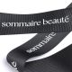 Bedrucktes Ripsband schwarz mit Logo in weiss, 38 mm