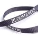 Bedrucktes Ripsband schwarz mit Logo in weiss, 9 mm